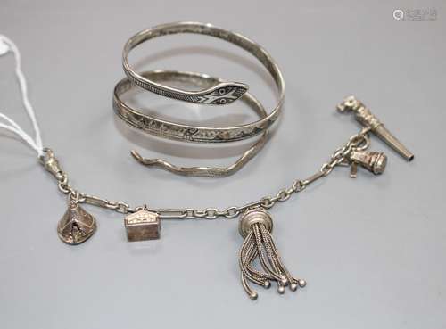 A modern silver and niello serpent bangle and a white metal tassle bracelet hung with four