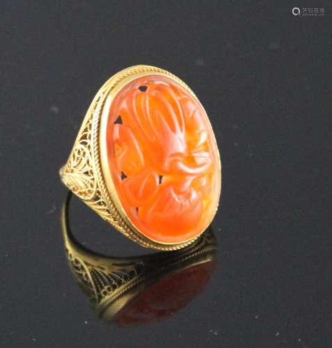 A 14k filigree yellow metal and orange chalcedony set dress ring, carved with fruit, size M, gross