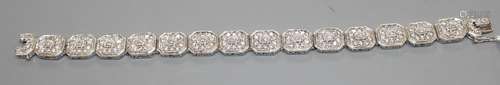 A modern 14k white metal and diamond encrusted octagonal link bracelet, 18.3cm, gross weight, 35.8