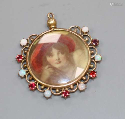 A Middle Eastern? yellow metal, white opal an red paste? set glazed circular pendant, overall