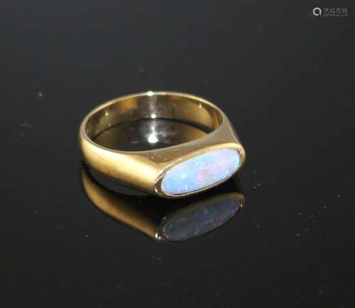 A modern 9ct gold and collet set white opal set dress ring, size M, gross weight 3.9 grams.