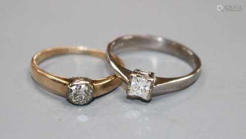 A modern 18ct white gold and princess cut solitaire diamond ring and a 585 and solitaire diamond