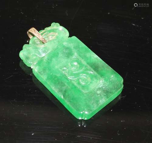 A simulated jade rectangular pendant with yellow metal mount (tests at 9ct gold), carved with