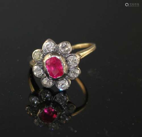 A yellow and white metal, ruby and diamond set oval cluster ring, (adapted), with GCS certificate (