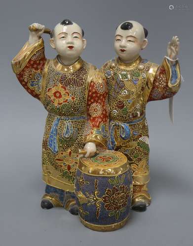 A Satsuma pottery group of two boys drumming height 28cm