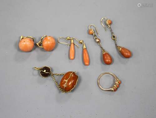 Tow pairs of yellow metal and coral drop earrings, a pair of coral ear clips, a three stone coral