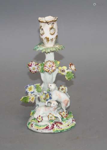 An early Derby figural 'sheep and tree' candlestick, c.1758, 21.5cm Condition: With losses to the