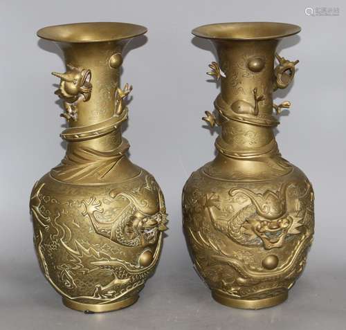 A pair of Chinese gilt bronze vases, decorated with dragons in relief, height 41cm Condition: