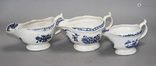 A Lowestoft blue and white sauceboat, c.1770 and two Worcester blue and white sauceboats, c.1758-65,