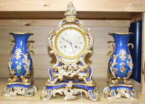 A 19th century French Ed Honore of Paris porcelain three piece clock garniture, clock 34cm, vases