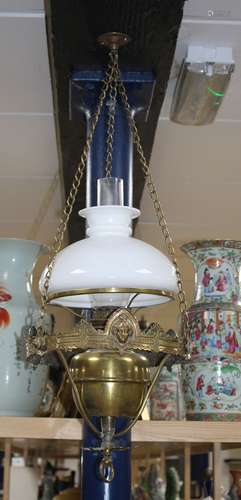 An Edwardian brass hanging oil lamp with opaque shade, overall drop 80cm Condition: Shade and flue