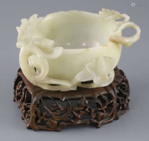 A Chinese pale celadon jade 'lotus' cup, late Ming dynasty, the cup formed as a lotus flower