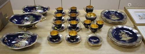 A Carltonware thirty five piece coffee and dessert service, with chinoiserie decoration on a dark