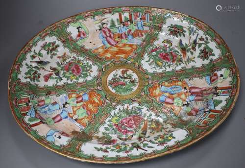 A 19th century Cantonese porcelain oval dish, decorated with panels of figures and birds, 42 x 34cm,