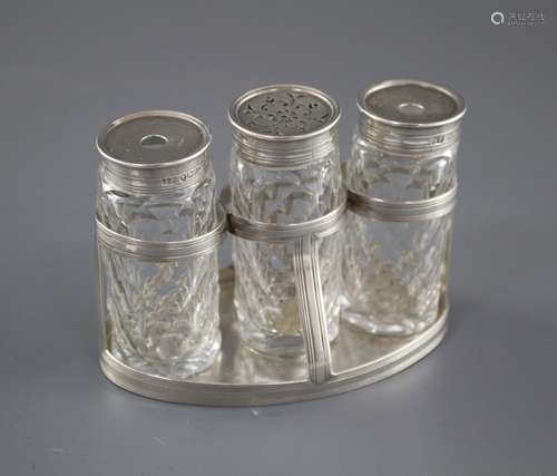 A George III silver oval ink bottle stand, London, 1799 (no maker's mark), with three later