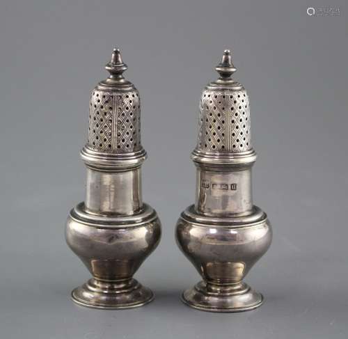 A pair of George V silver baluster pepperettes by S.W. Smith & Co, Birmingham, 1919, height 10.