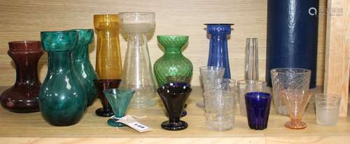 Seven Edwardian coloured glass hyacinth vases, a slender specimen vase and a thirteen other