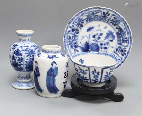 A Chinese blue and white tea bowl and saucer and two jars, Kangxi, some damage largest diameter