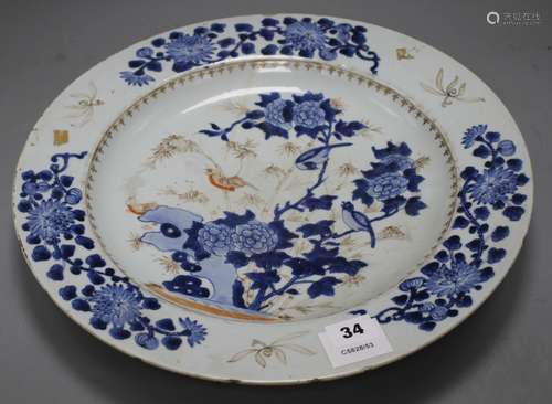 A Chinese grisaille and underglaze blue dish, c.1740, decorated with birds, bamboo, rocks and