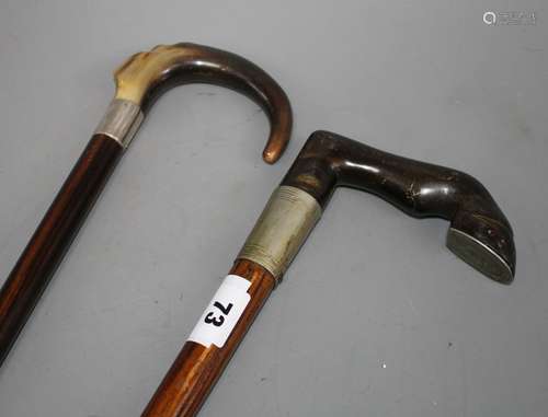 An Edwardian oak walking stick with pewter mounted horn horse hoof handle, 84cm and an ebony walking