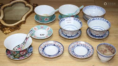 Six Chinese porcelain bowls, eight stands, three spoons and a candle holder, second half 20th