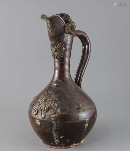 A Turkish Cannakale pottery ewer, 19th century, applied with medallions and scroll decoration and