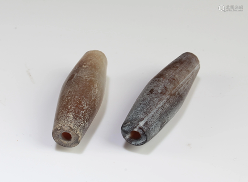 A Group of Two Tibetan 'First-Line' Dzi Beads