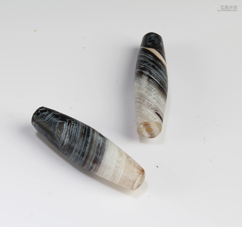 A Group of Two Tibetan 'First-Line' Dzi Beads