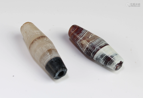 A Group of Two Tibetan 'First-Line' Dzi Beads