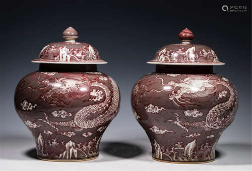 A PAIR OF CHINESE PORCELAIN RED UNDER GLAZE LIDDED JAR