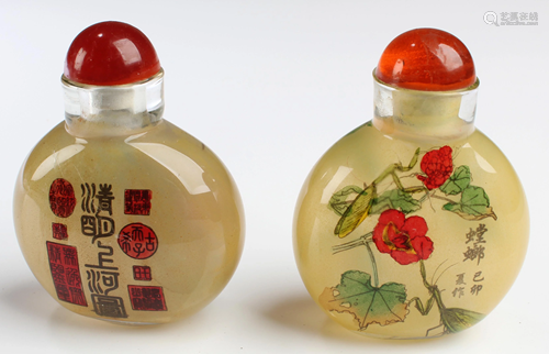 A Group of Two Peking Glass Snuff Bottles