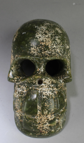 A Jadestone Skeleton Head Ornament