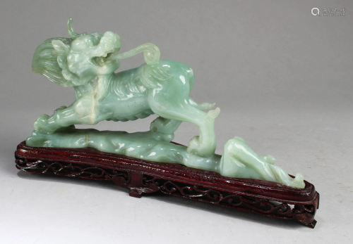 A Chinese Carved Jade Qilin Statue with Stand