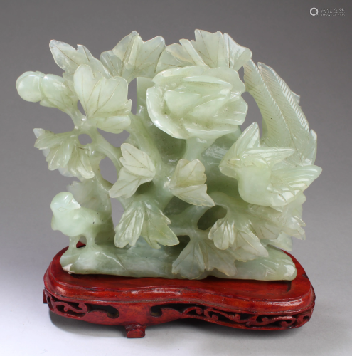 A Carved Jadestone Ornament with Stand