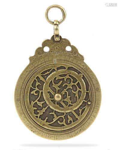 A BRASS ASTROLOBE SIGNED BY MUHAMMAD MUQIM IBN 'ISA IBN AL-HADDAD, LAHORE, DATED 1051 AH/1641-42 AD