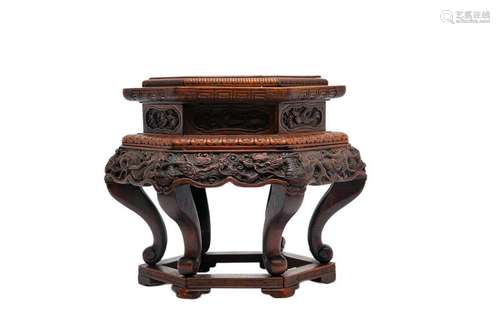 BASE IN NATIVE WOOD WITH CARVED DECORATION OF DRAG…