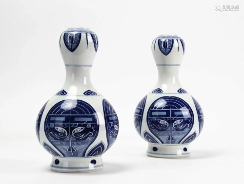 A Pair Of Blue And White Vases