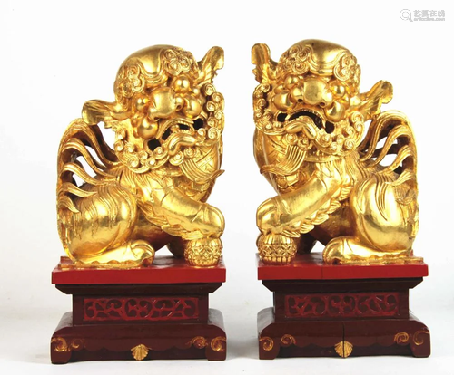 A Pair Of Carved wood Foo Lion Figure