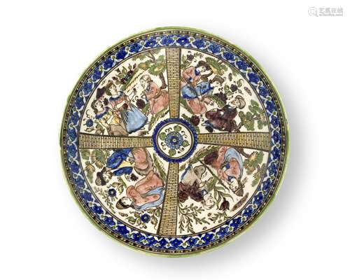 A Qajar underglaze-painted pottery dish Persia, 19th Century