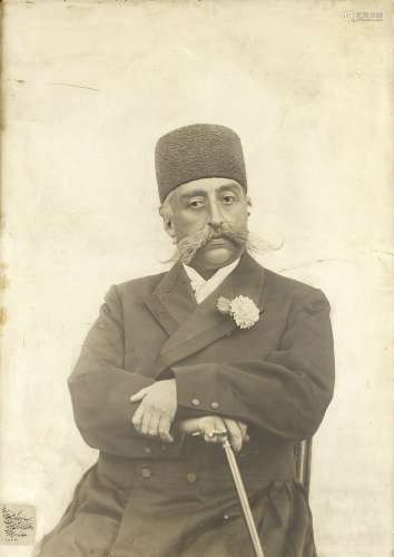 A monumental photograph of Muzaffar al-Din Shah Qajar (reg. 1896-1907) enlarged by the Court phot...