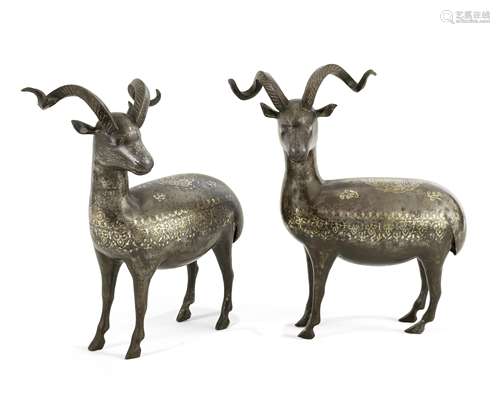 A pair of Qajar gold and silver damascened steel rams Persia, 19th Century(2)