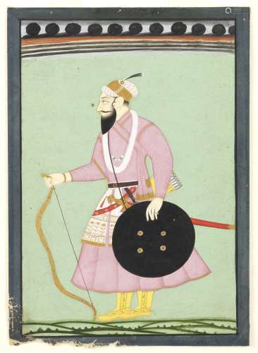 Guru Hargobind Singh (1595-1644), the sixth Sikh Guru, standing armed with sword, shield, bow and...