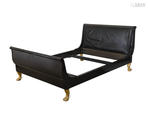 An Empire Style Ebonized and Gilt Wood …