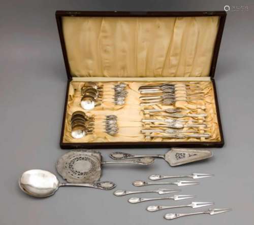 Cutlery for twelve persons, German, early 20th century, silver 800/000, with floral reliefdecoration