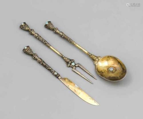 Three pieces of cutlery, 19th century, marked silver and fully gilded, with figurative andfloral