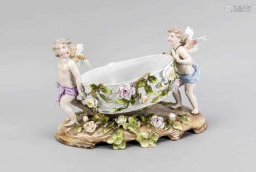 Figurative table centerpiece, Thuringia 20th cent., Basket bowl, carried by two putti, onoval