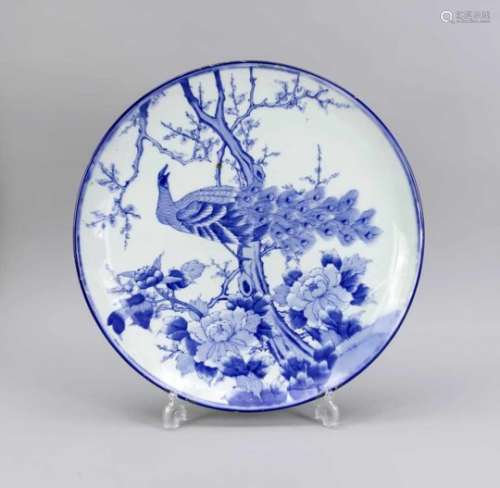 Blue-white plate/bowl with peacock, China, 20th cent. Underside of banner with tendril,bottom with