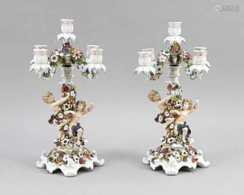 Pair of figurative candlesticks, prob. Thuringia, 20th cent., 5 flames, on curved foot,set with