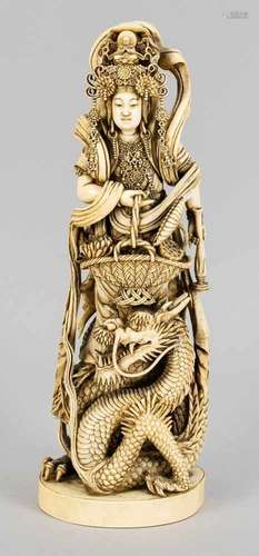 Guanyin with dragons, China, around 1900, ivory. Oval base with openwork dragon footing,with a