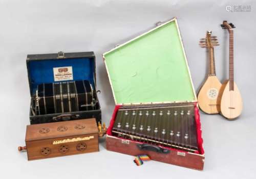 Mixed lot of three instruments, 20th century, consisting of 2 large stringed instrumentsmade of